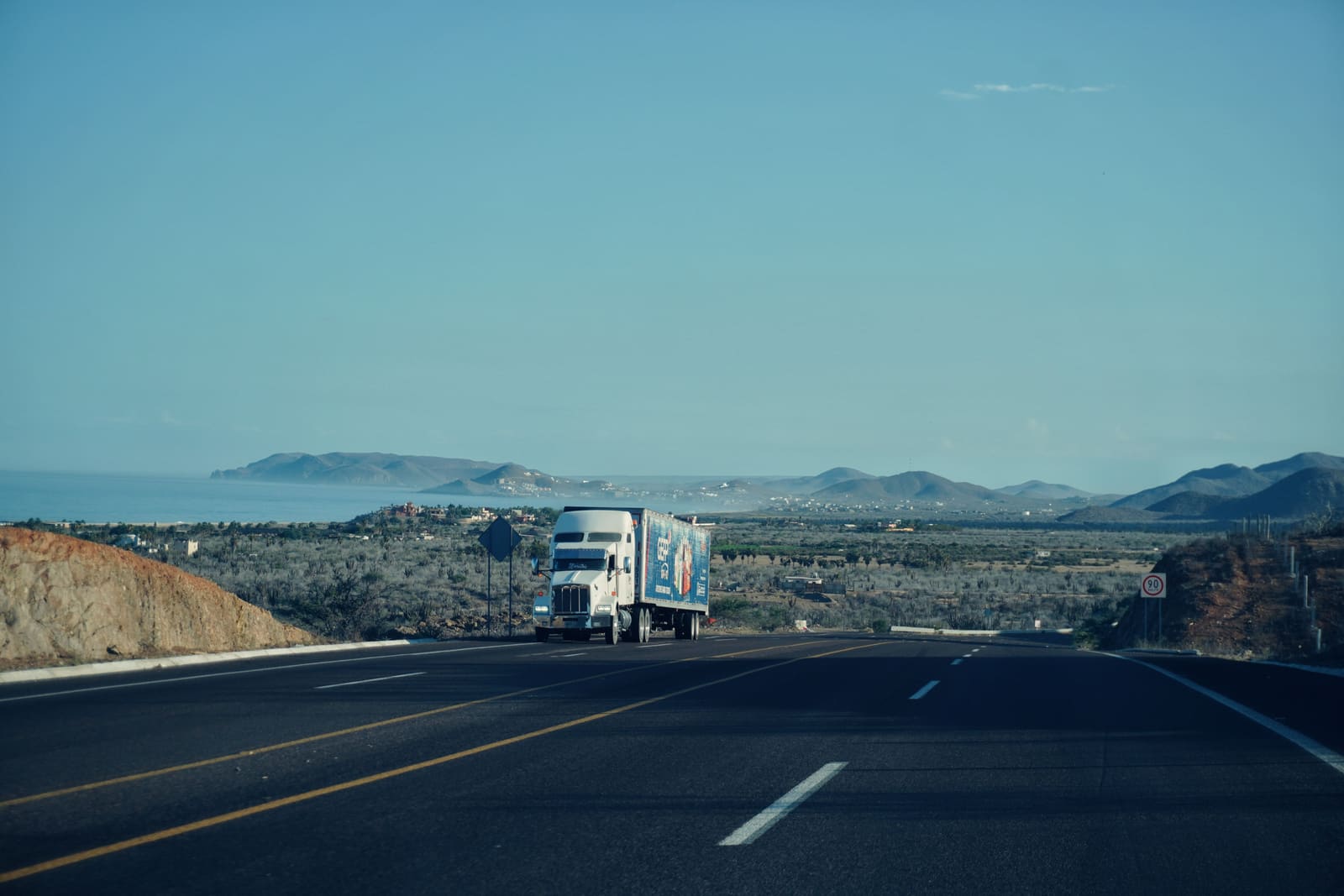 Freight truck carrying cargo on a highway