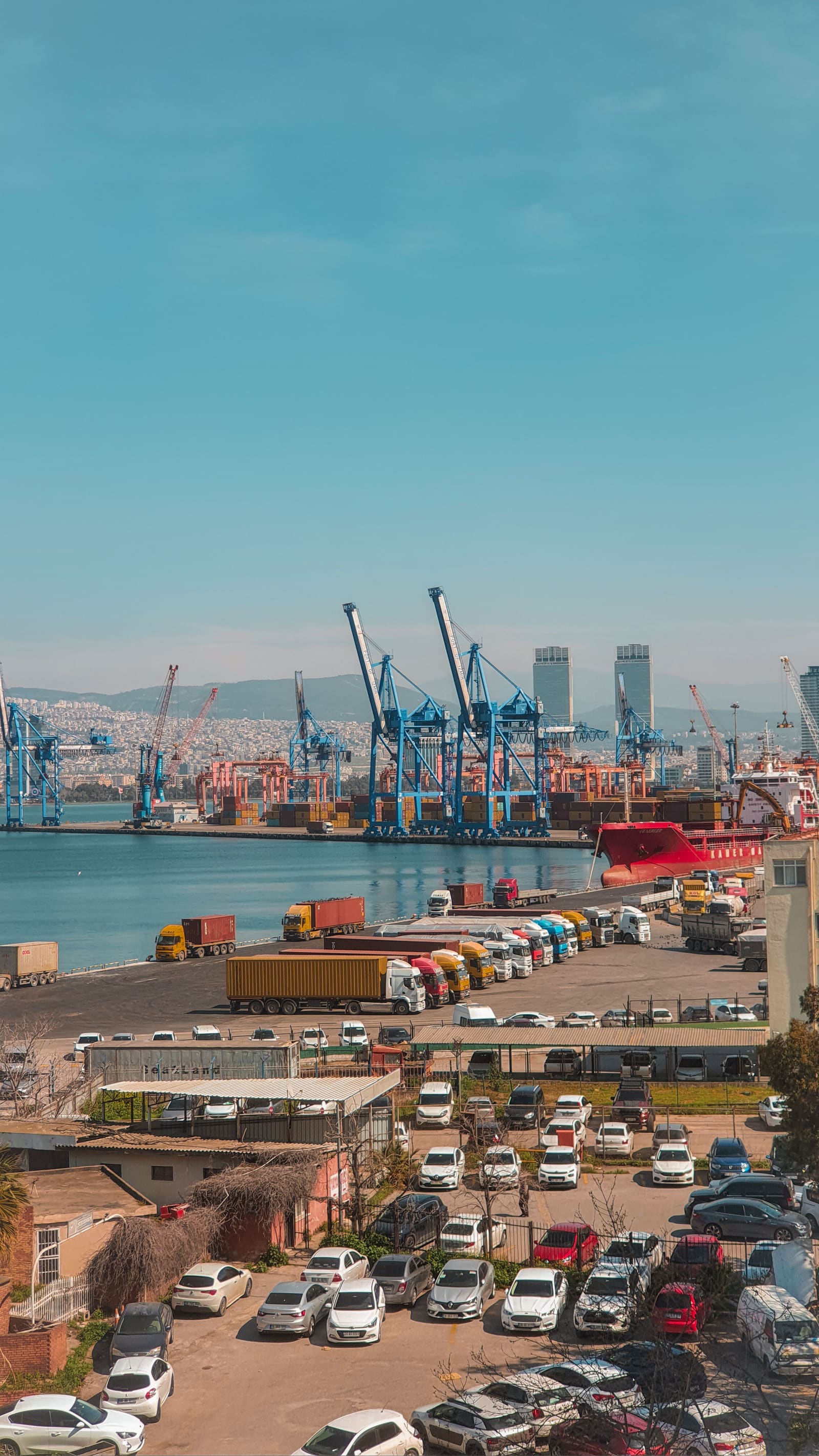International cargo vessel and containers at a busy trade port